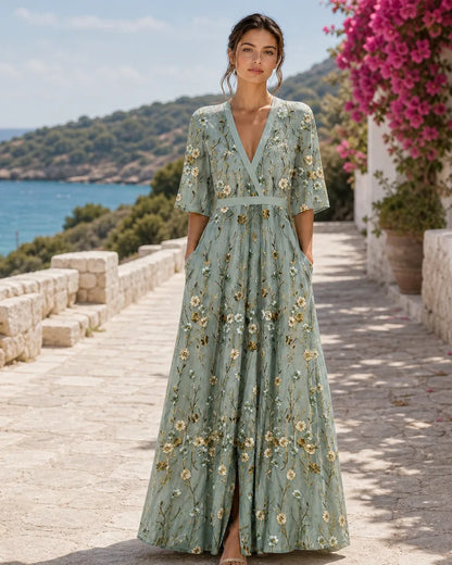 Fiorella sage green floral maxi dress on a Mediterranean terrace