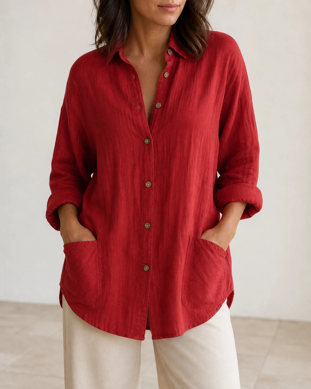 Women's red relaxed longline shirt, front product view.
