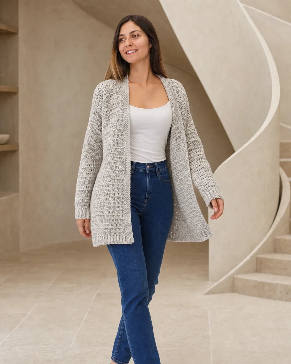 Grey lightweight crochet cardigan styled in a bright interior.