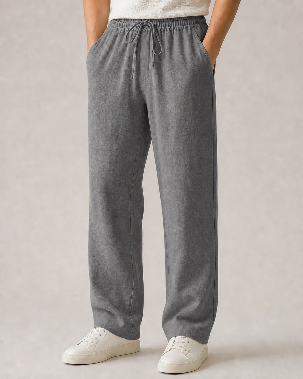 Men’s grey linen wide-leg pants with elastic drawstring waist.