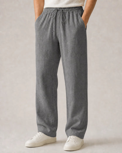 Men’s grey linen wide-leg pants with elastic drawstring waist.