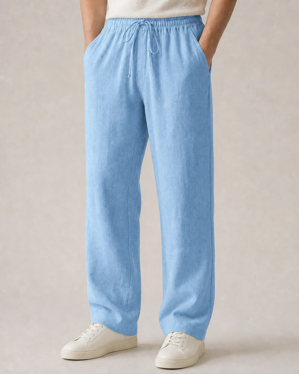 Men’s light blue linen wide-leg pants with elastic drawstring waist.