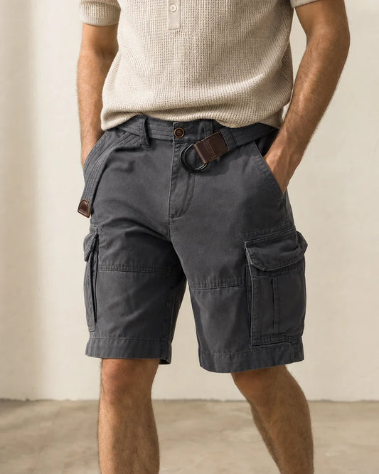 Men's charcoal washed-cotton cargo shorts with canvas D-ring belt, front hero view.