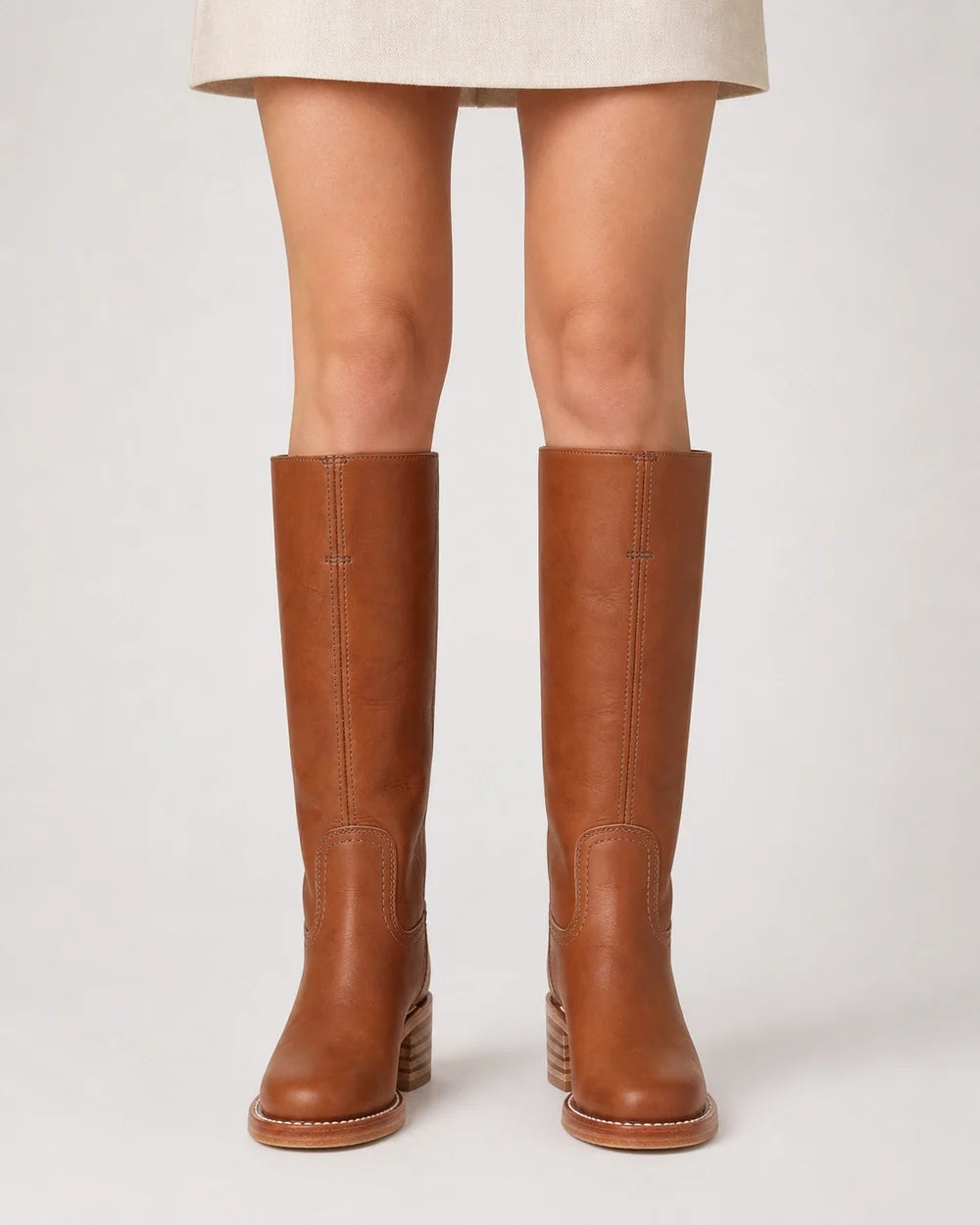 Brown round-toe knee-high boots, front view