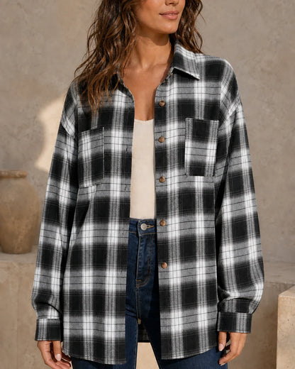 Women's black, white and grey oversized plaid shirt, front three-quarter worn view. — momount-womens-oversized-plaid-shirt-black-13-hero.webp
