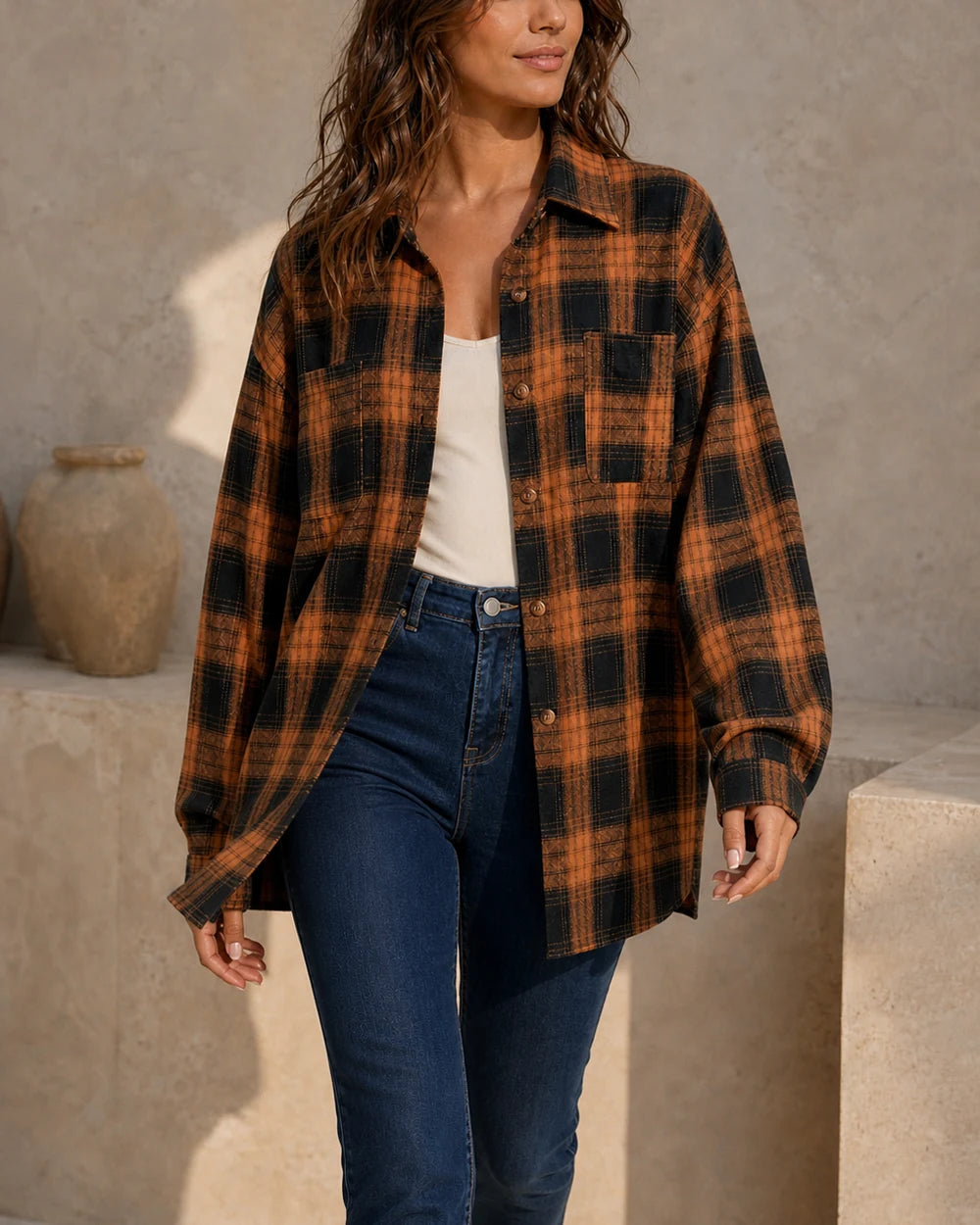 Women's caramel and black oversized plaid shirt, walking view. — momount-womens-oversized-plaid-shirt-caramel-06-movement.webp