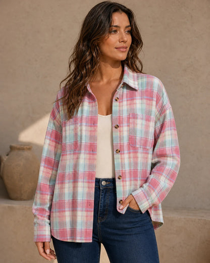 Women's pink pastel oversized plaid shirt, front three-quarter worn view. — momount-womens-oversized-plaid-shirt-pink-09-hero.webp
