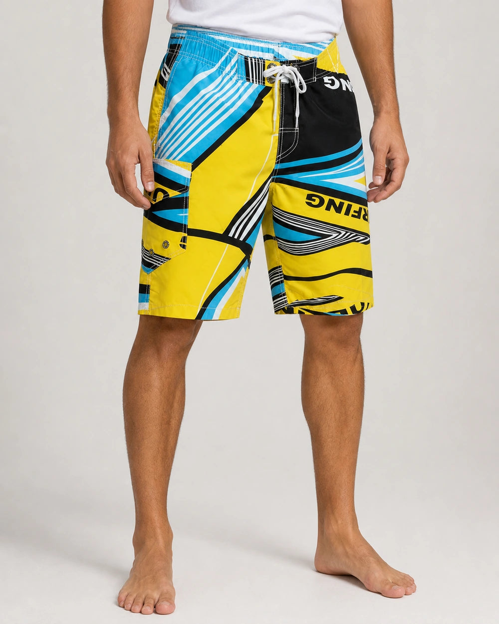 Men’s blue and yellow geometric knee-length swim shorts, front three-quarter view.