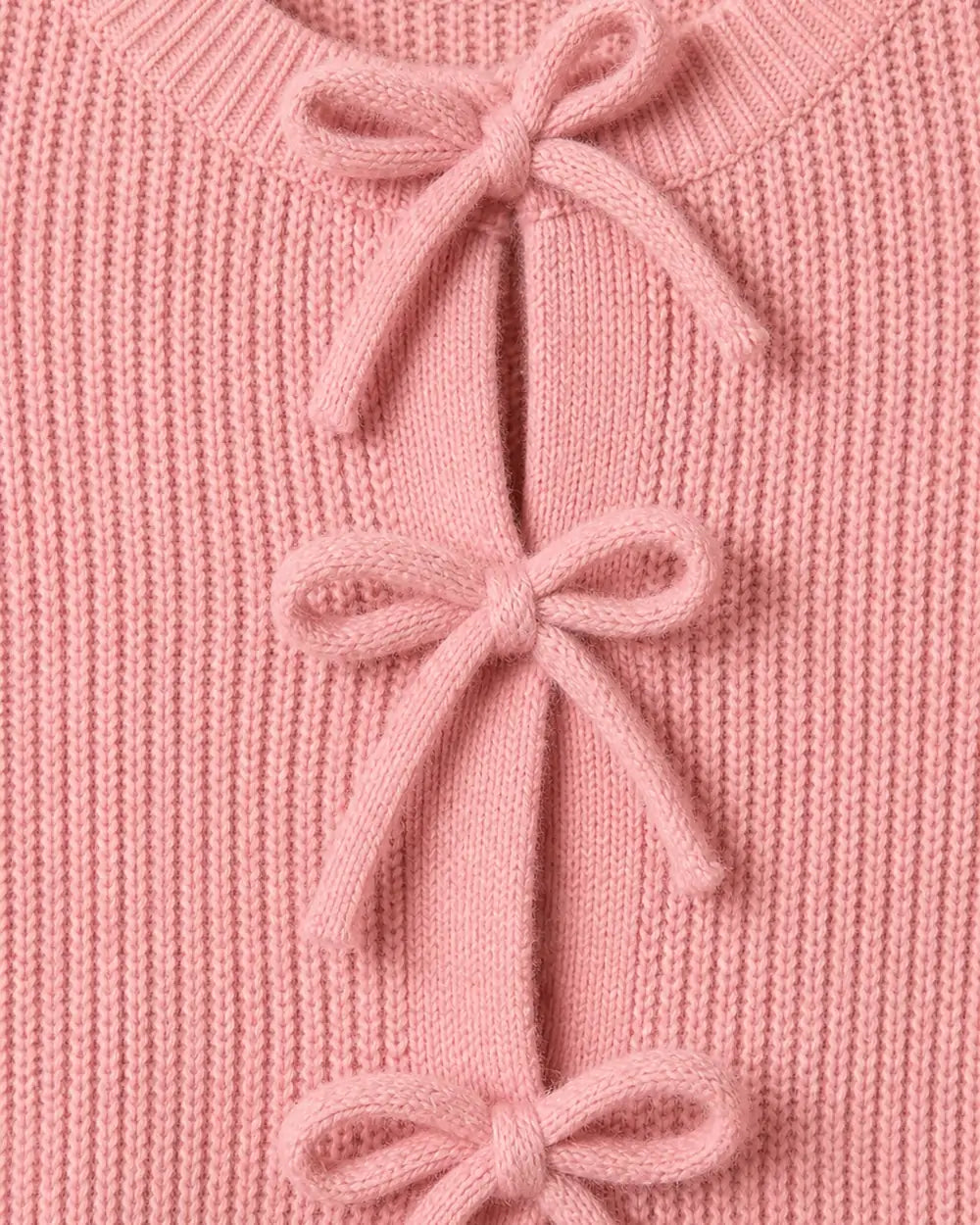 Close-up of the pink rib knit and tonal bow ties.
